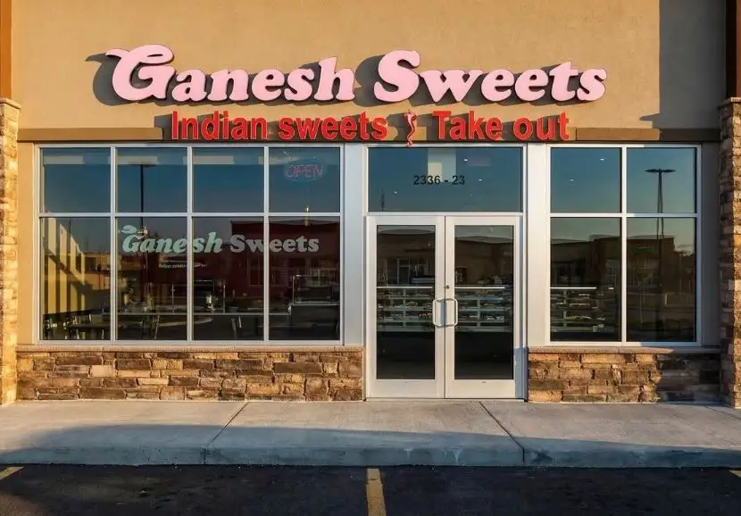 A delicious assortment of traditional Indian sweets including laddus, barfi, and jalebi freshly made at Ganesh Sweets in Edmonton.